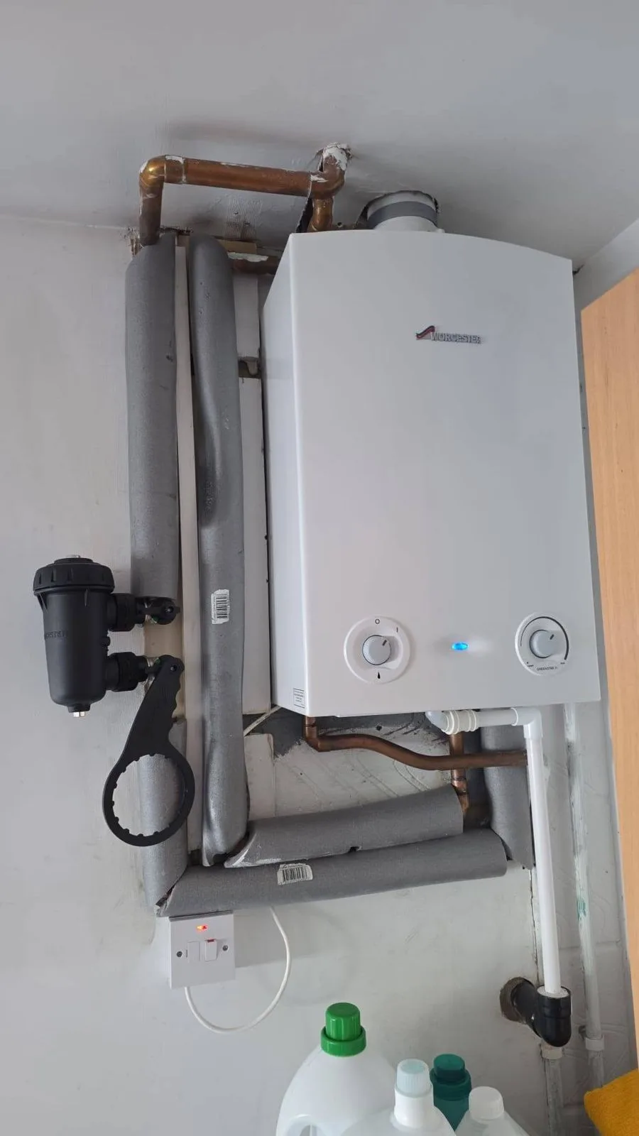 New Worcester Greenstar fitted, with a magnetic filter and service spanner alongside and the pipework fully insulated.